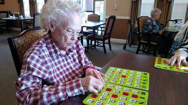 Image of elderly woman playing bingo