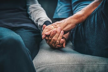 elderly holding hands