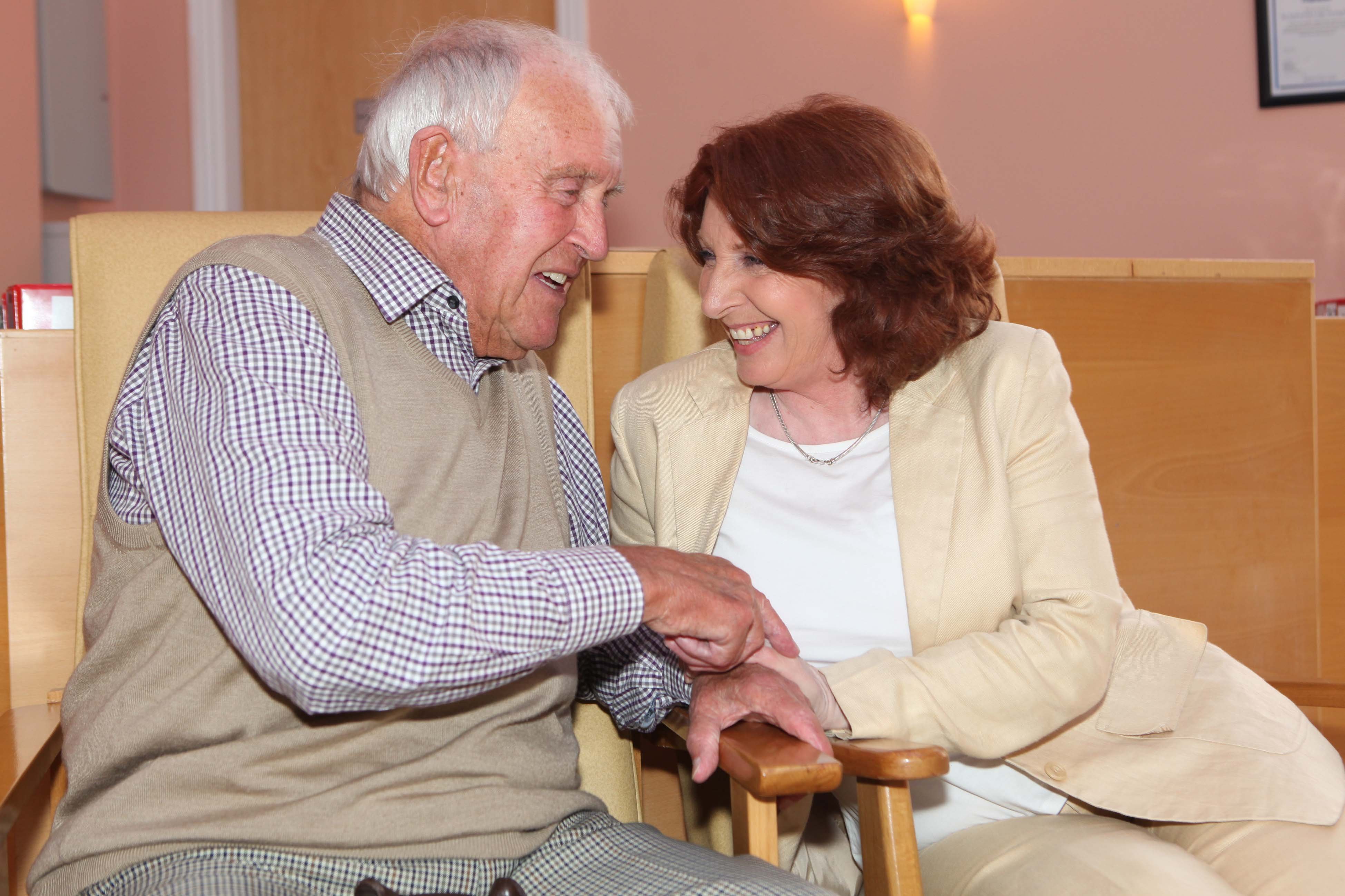 Photo of a man and women laughing