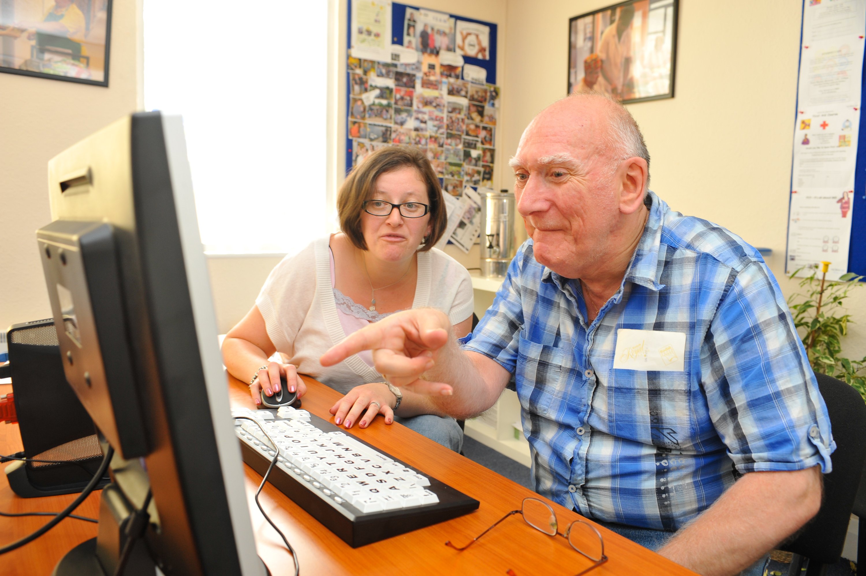 Photo of elderly man using a computer