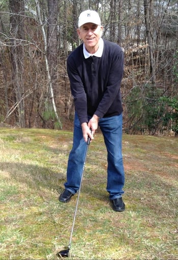 Senior living resident playing golf