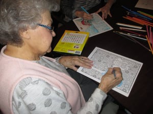Adult coloring activities at a Senior Solutions senior living community