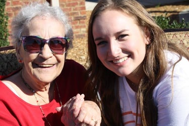 Female senior living resident and teenage girl