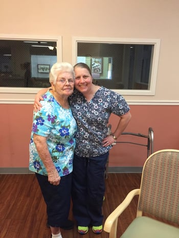 Assisted Living staff member interacting with resident