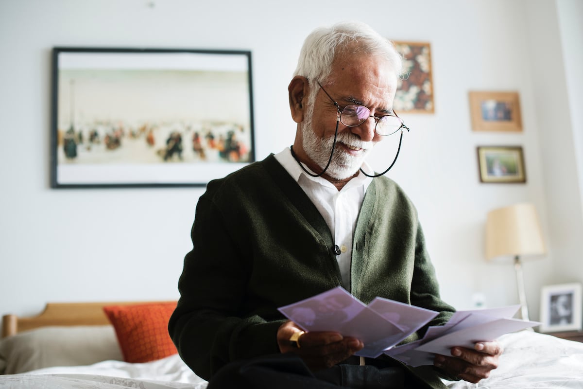 Senior Man Looking at Photos