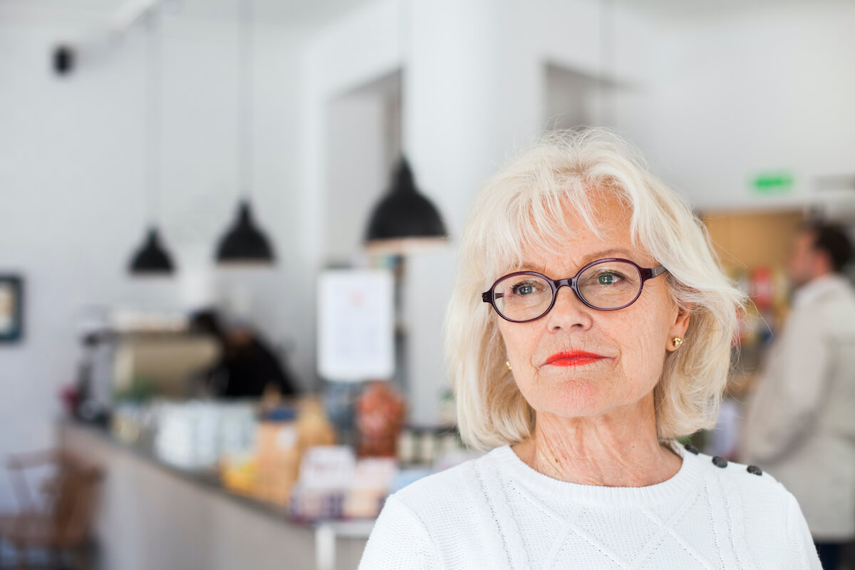 close-up-of-senior-smiling-at-restaurant-P8X5K9A (1)